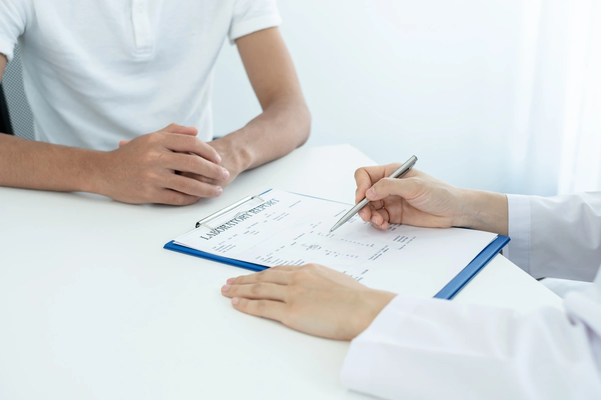 Doctor reviewing medical reports and psychiatric treatment plans for clinical depression treatment.