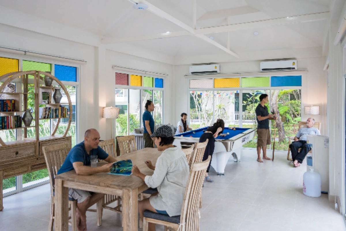 Spacious common area at a Thailand mental health retreat where clients relax and connect in a supportive environment.