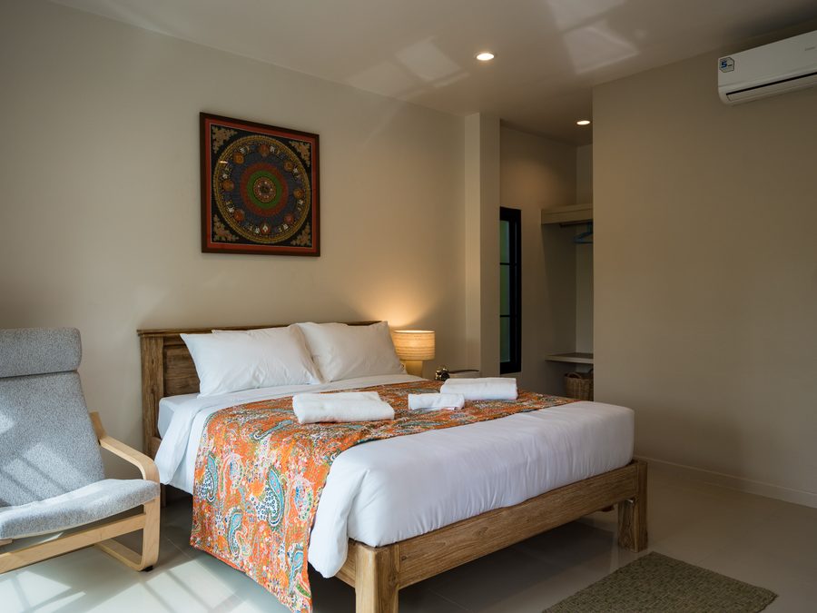 A bedroom looking out into the forest