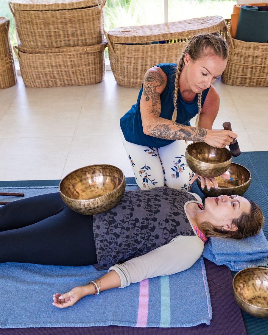 Singing bowls laid out for a sound bath session in the yoga sala